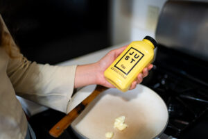 Woman holding a bottle of Just Egg